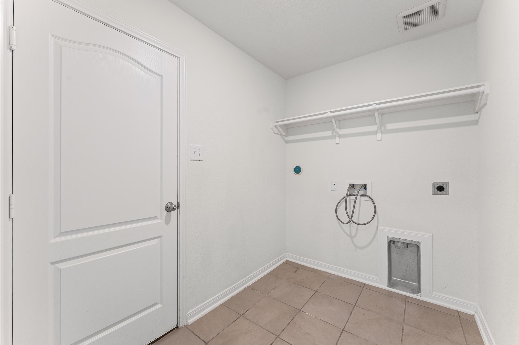 5031 Gazelle Leap Lane Richmond, TX 77406 - Photo 26 of 30 a view of a room with racks on the wall and a window