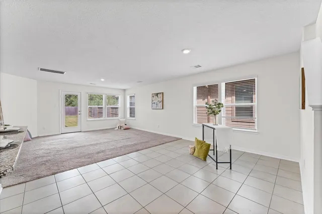 a view of empty room with windows