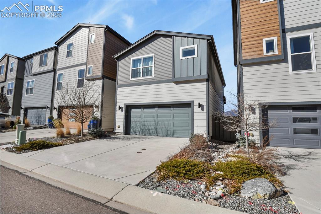 11314 Modern Meadow Loop Colorado Springs, CO 80921 - Photo 28 of 30 a front view of a house with yard