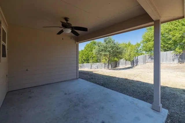 a view of a room with a floor to ceiling window