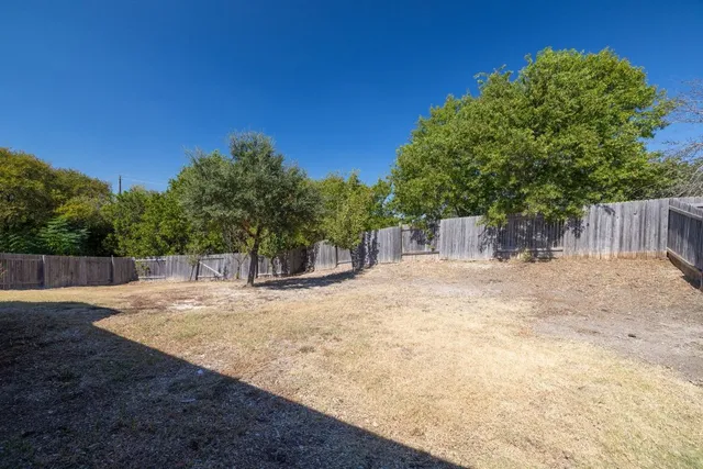a view of backyard with green space