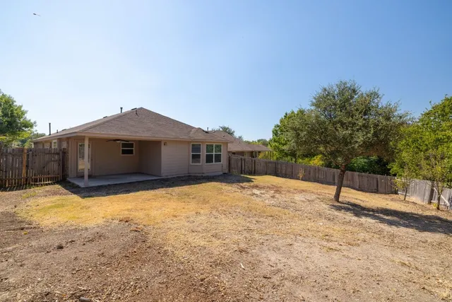a house with trees in the background