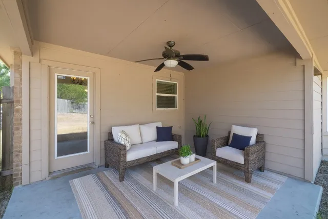 a living room with furniture and a window