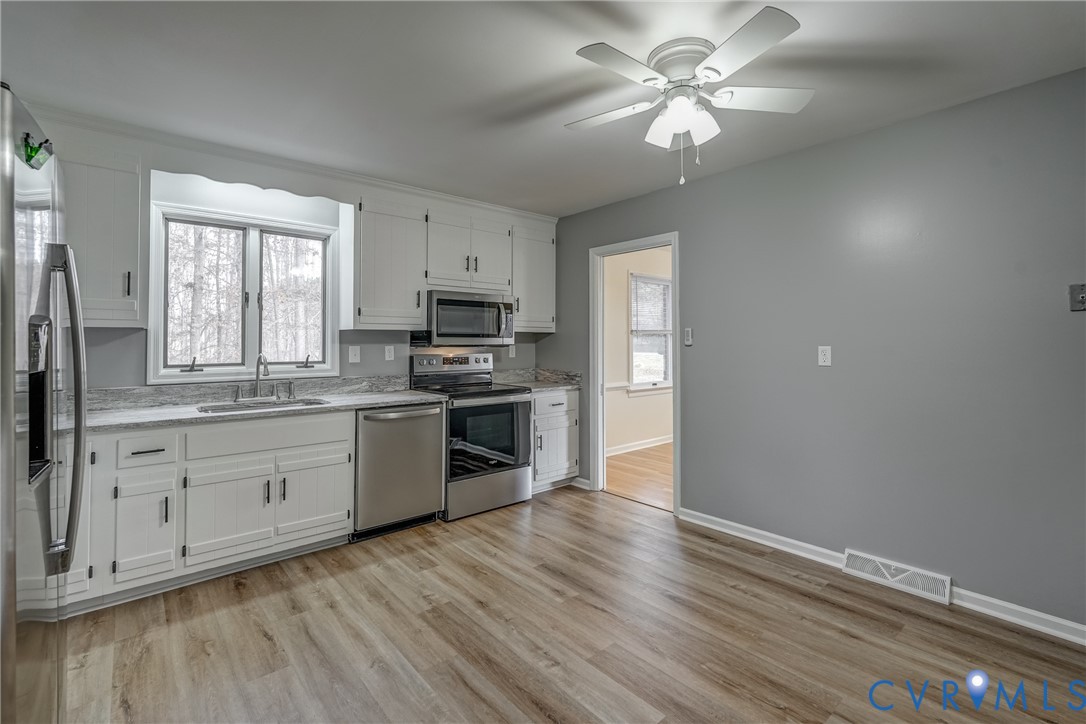 3534 Davis Mill Road Goochland, VA 23063 - Photo 20 of 40 a kitchen with a white cabinets and window