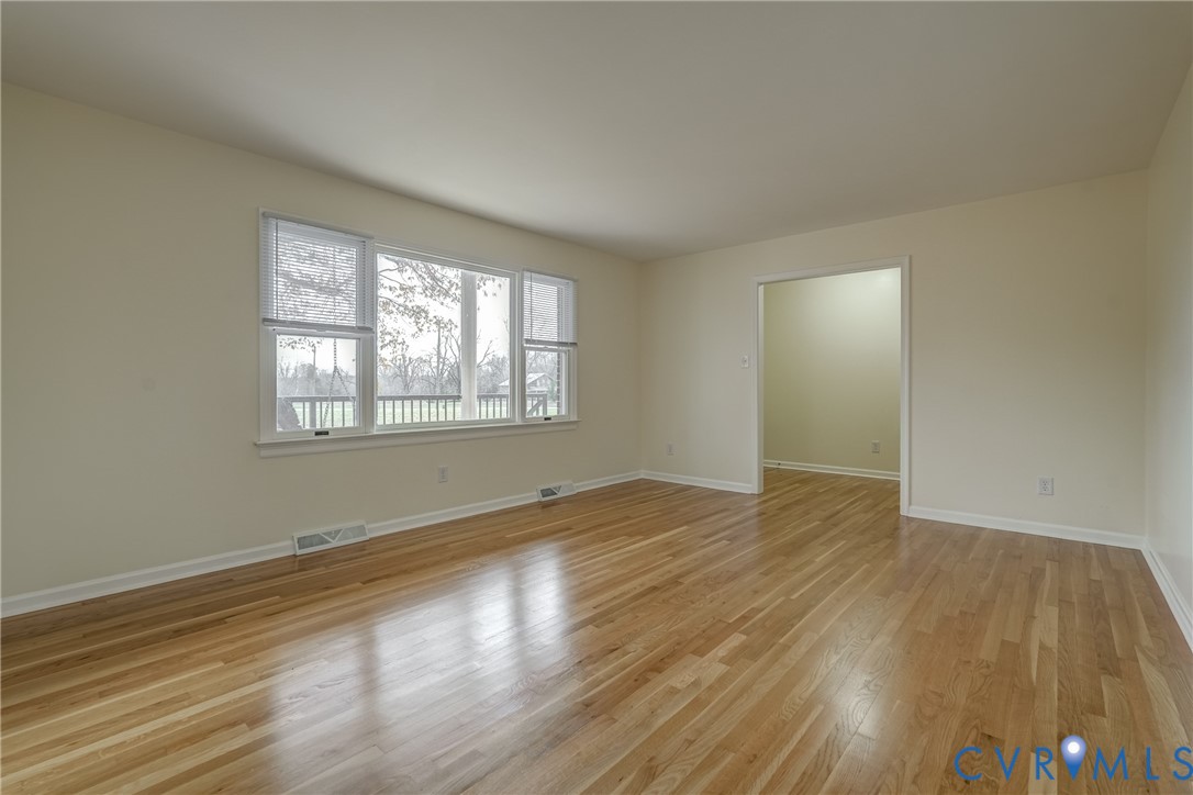 3534 Davis Mill Road Goochland, VA 23063 - Photo 29 of 40 a view of an empty room with wooden floor and a window