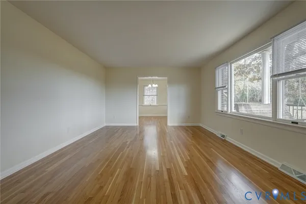 a bathroom with a sink vanity granite toilet and a mirror
