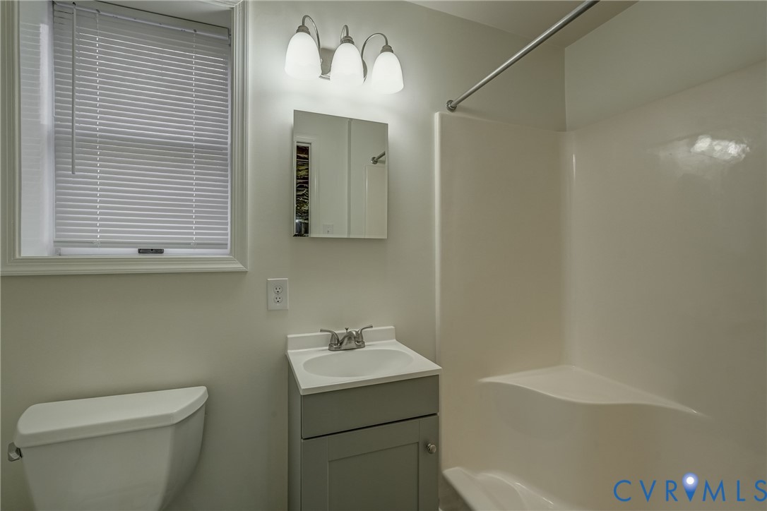 3534 Davis Mill Road Goochland, VA 23063 - Photo 37 of 40 a bathroom with a sink a toilet and shower