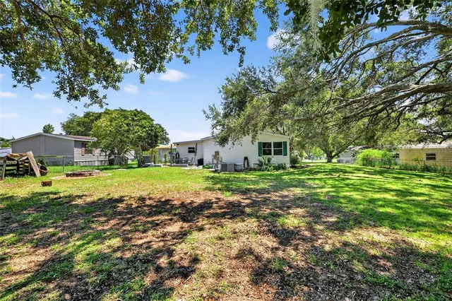 a view of a house with a big yard
