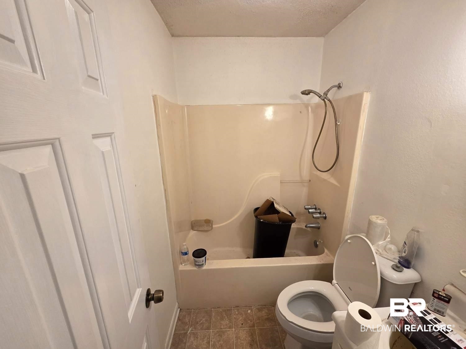 106 West 16th Street Bay Minette, AL 36507 - Photo 17 of 19 Full bath featuring toilet, tile patterned flooring, and bathing tub / shower combination
