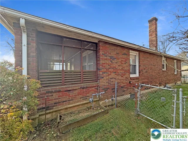a backyard of a house with seating space