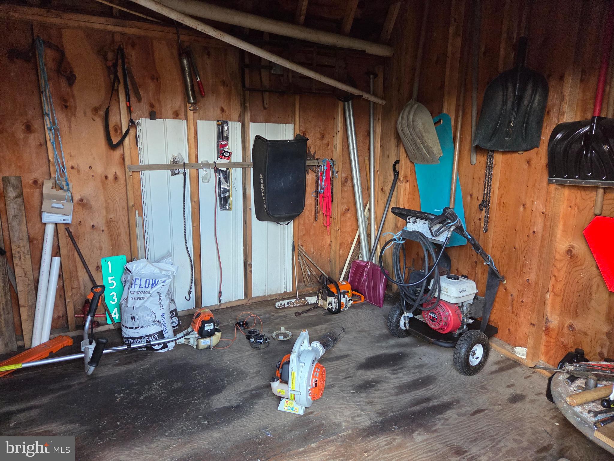 83 Woodpecker Drive Mount Pleasant Mills, PA 17853 - Photo 68 of 87 Rustic shed filled with tools and equipment.