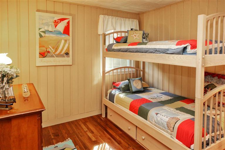 94 Waterfield Road Osterville, MA 02655 - Photo 7 of 12 a bedroom with a bed and a dresser