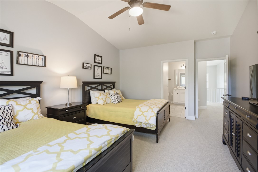 578 Sunset Point Drive West Union, SC 29696 - Photo 17 of 46 This spacious bedroom features vaulted ceilings and soft carpet, providing comfort and style.
