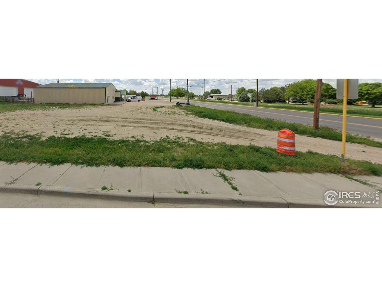 Daniels Street, Unit 1 Brush, CO 80723 - Photo 4 of 4 a picture of a park with large trees