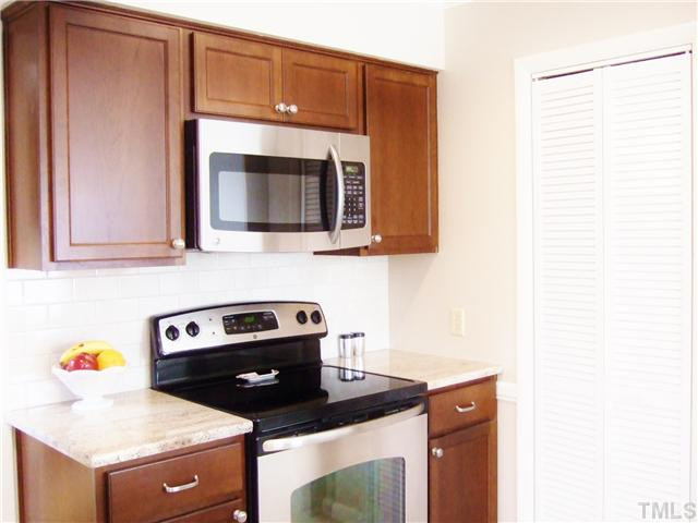 4225 Redington Drive Raleigh, NC 27609 - Photo 11 of 25 There is a pantry located to the right of the stove. The kitchen has under cabinet lighting and new upper recessed lighting Kitchen