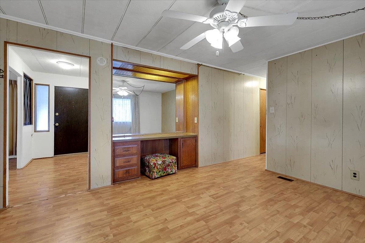 10383 Larkin Road, Unit 43 Live Oak, CA 95953 - Photo 11 of 26 a view of a livingroom with a chandelier fan and wooden floor