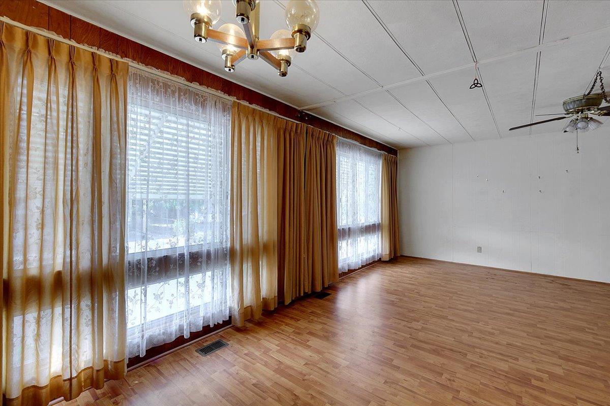 10383 Larkin Road, Unit 43 Live Oak, CA 95953 - Photo 12 of 26 a view of an empty room with wooden floor and a window