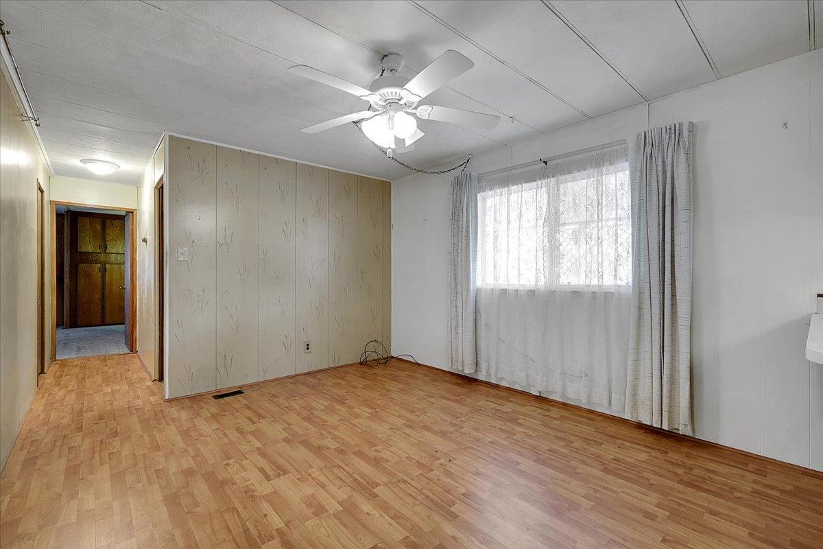 10383 Larkin Road, Unit 43 Live Oak, CA 95953 - Photo 14 of 26 a view of an empty room with wooden floor