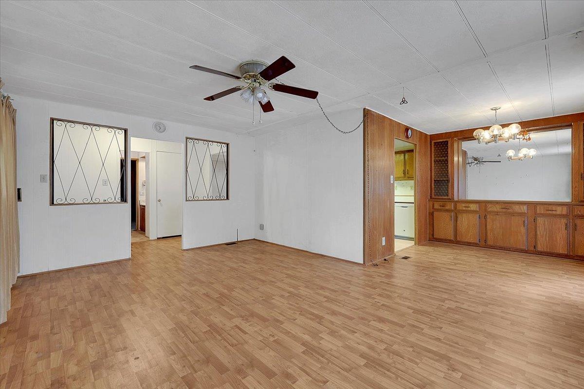 10383 Larkin Road, Unit 43 Live Oak, CA 95953 - Photo 15 of 26 a view of empty room with wooden floor and window