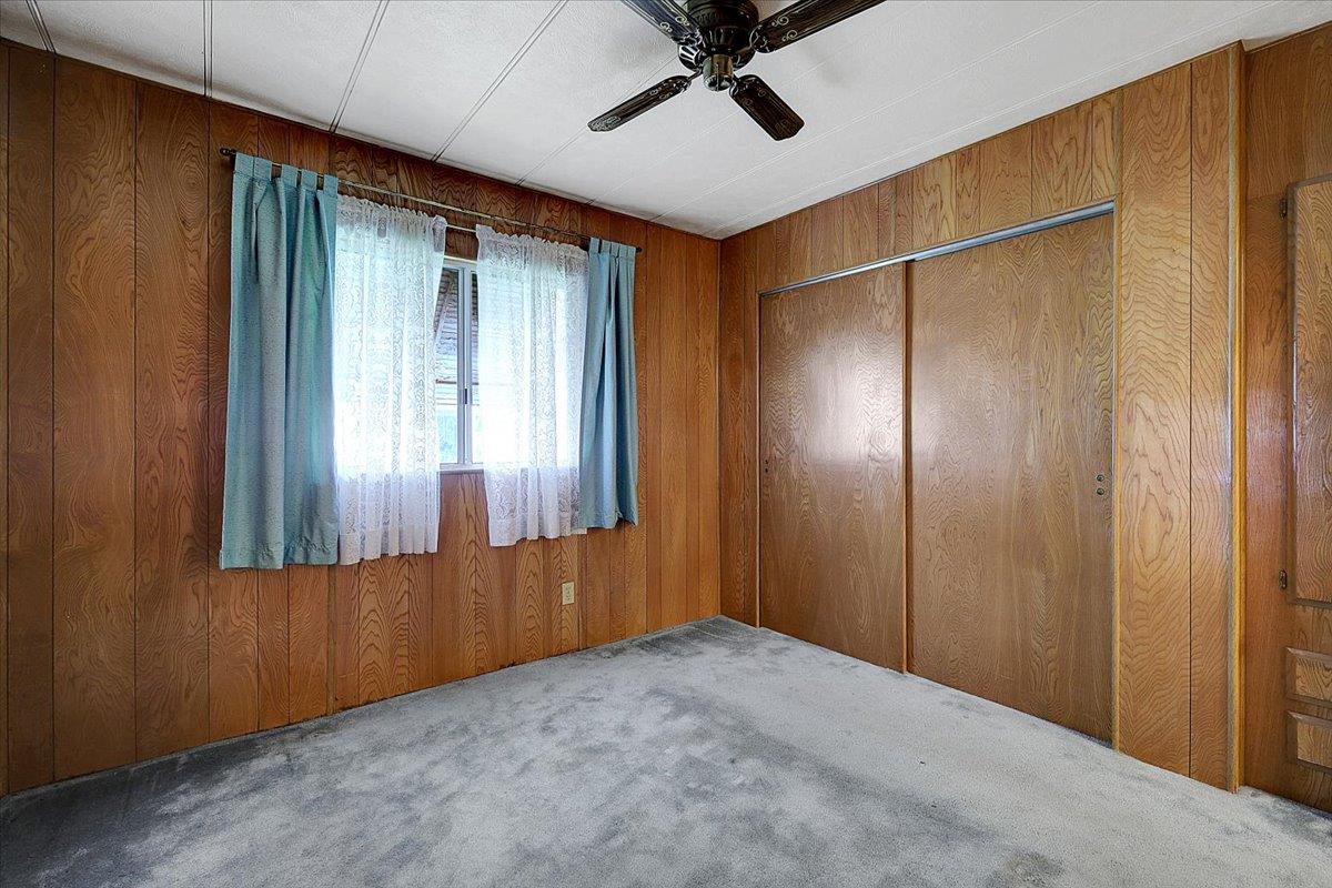 10383 Larkin Road, Unit 43 Live Oak, CA 95953 - Photo 24 of 26 an empty room with windows and closet