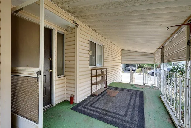 a view of a porch with furniture
