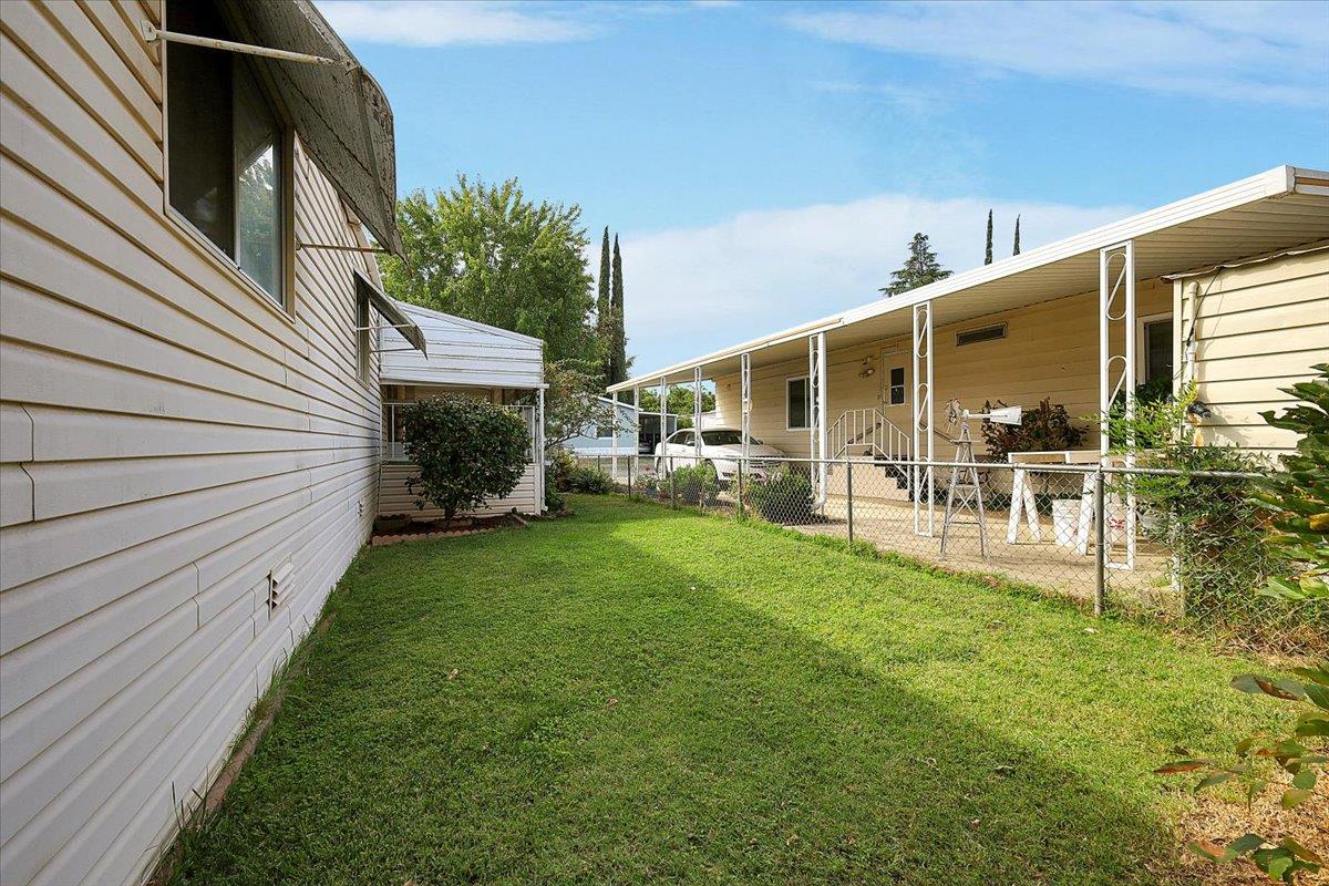 10383 Larkin Road, Unit 43 Live Oak, CA 95953 - Photo 5 of 26 a view of a porch with chairs and backyard