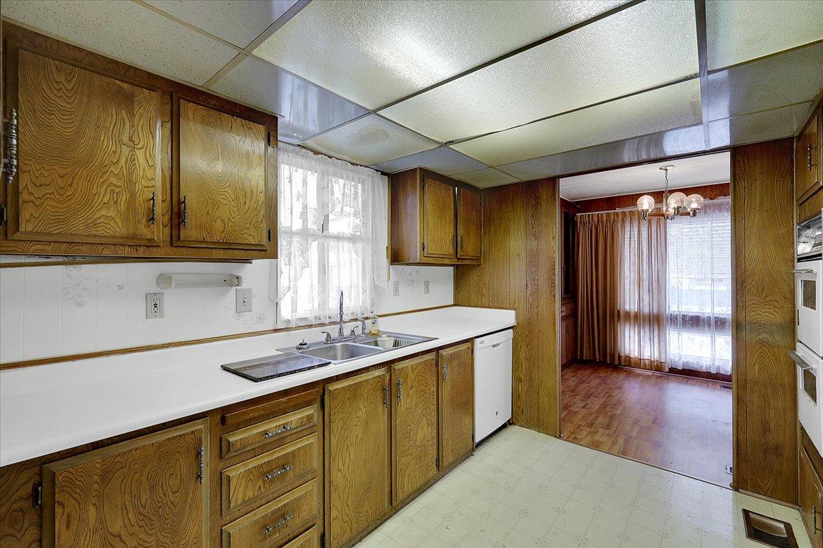 10383 Larkin Road, Unit 43 Live Oak, CA 95953 - Photo 7 of 26 a kitchen with stainless steel appliances granite countertop a sink a stove cabinets and wooden floor
