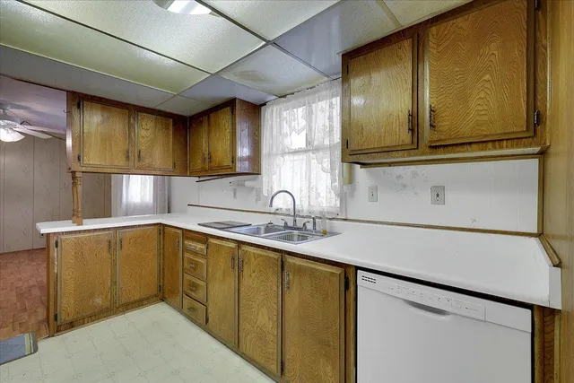 a kitchen with stainless steel appliances granite countertop a sink and cabinets