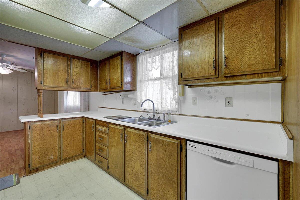 10383 Larkin Road, Unit 43 Live Oak, CA 95953 - Photo 8 of 26 a kitchen with stainless steel appliances granite countertop a sink and cabinets