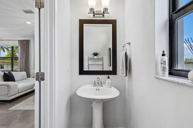a bathroom with a sink and a mirror