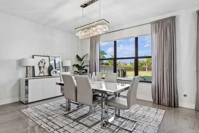 a large kitchen with a table and chairs