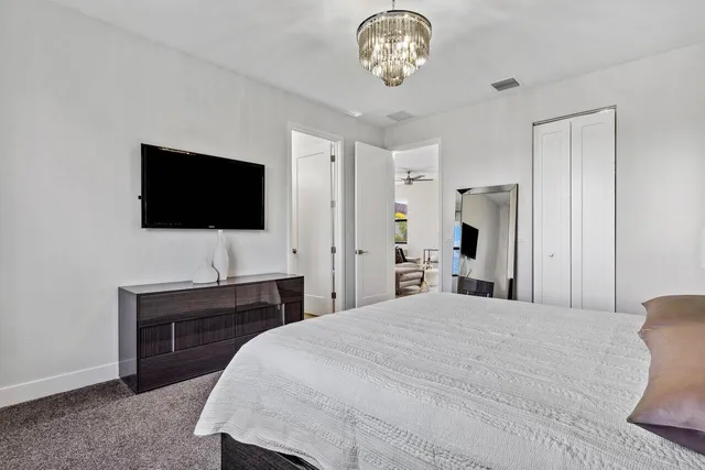 a view of walk in closet with clothes