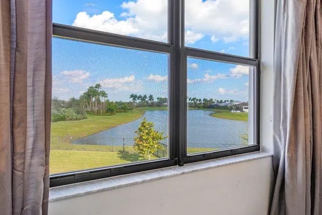 a view of a chair and table in back yard of the house