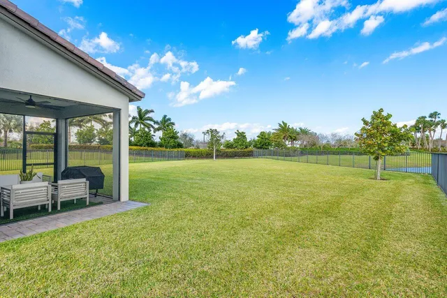 a view of a garden with lawn chairs