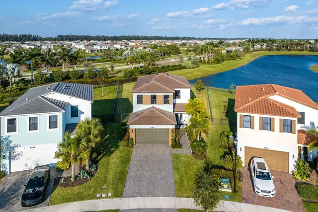 an aerial view of a house with a ocean view