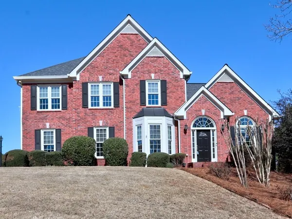 a front view of a house with yard