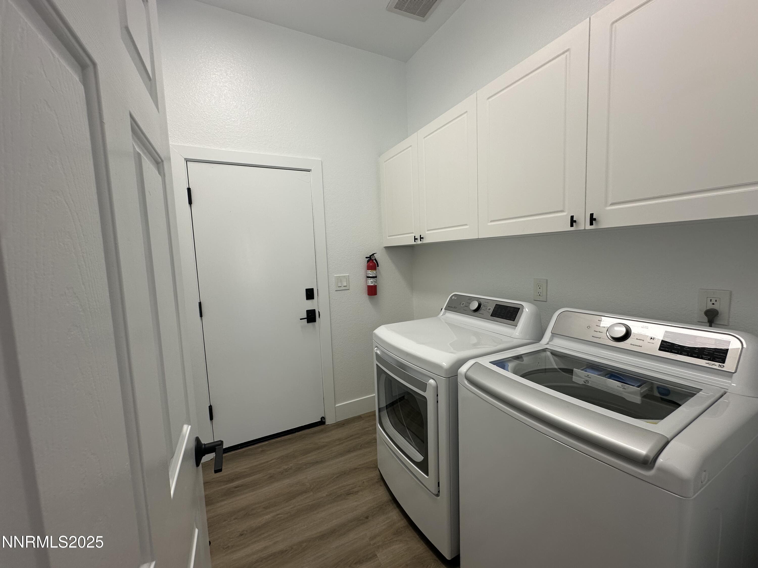9533 Steep Climb Court Reno, NV 89521 - Photo 24 of 34 a utility room with dryer and washer