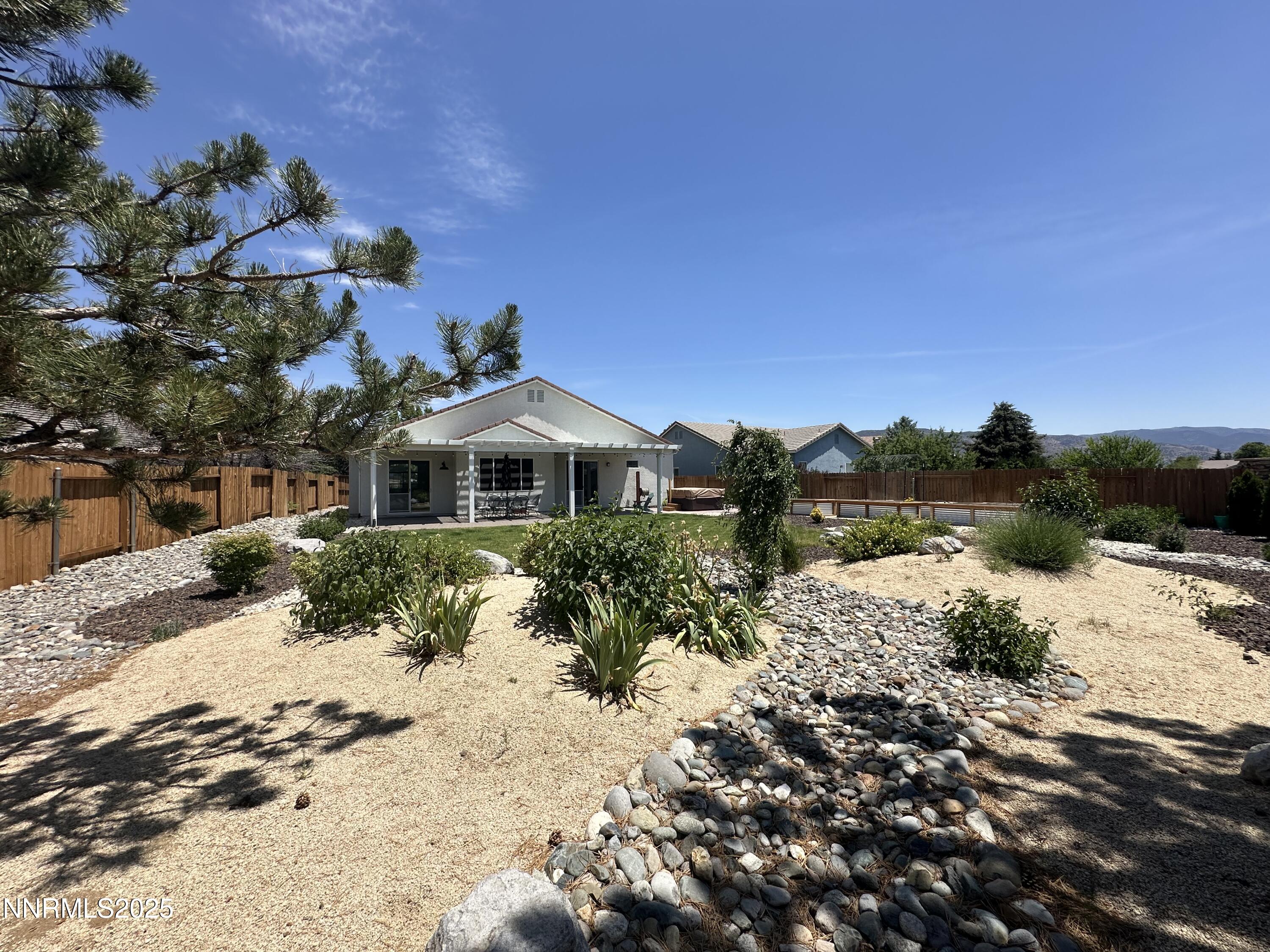 9533 Steep Climb Court Reno, NV 89521 - Photo 30 of 34 a front view of a house with a yard