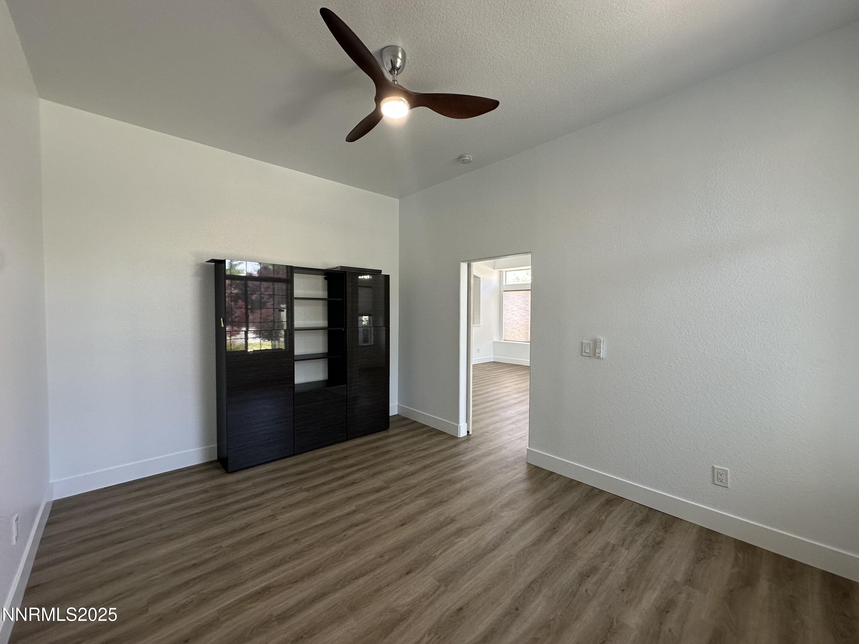 9533 Steep Climb Court Reno, NV 89521 - Photo 7 of 34 a view of empty room with wooden floor