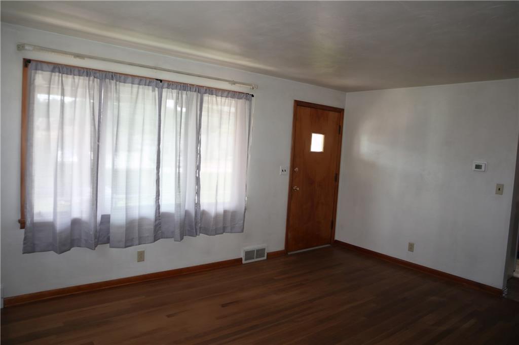 721 Spring Street Roscoe, PA 15477 - Photo 11 of 30 wooden floor in an empty room with a window