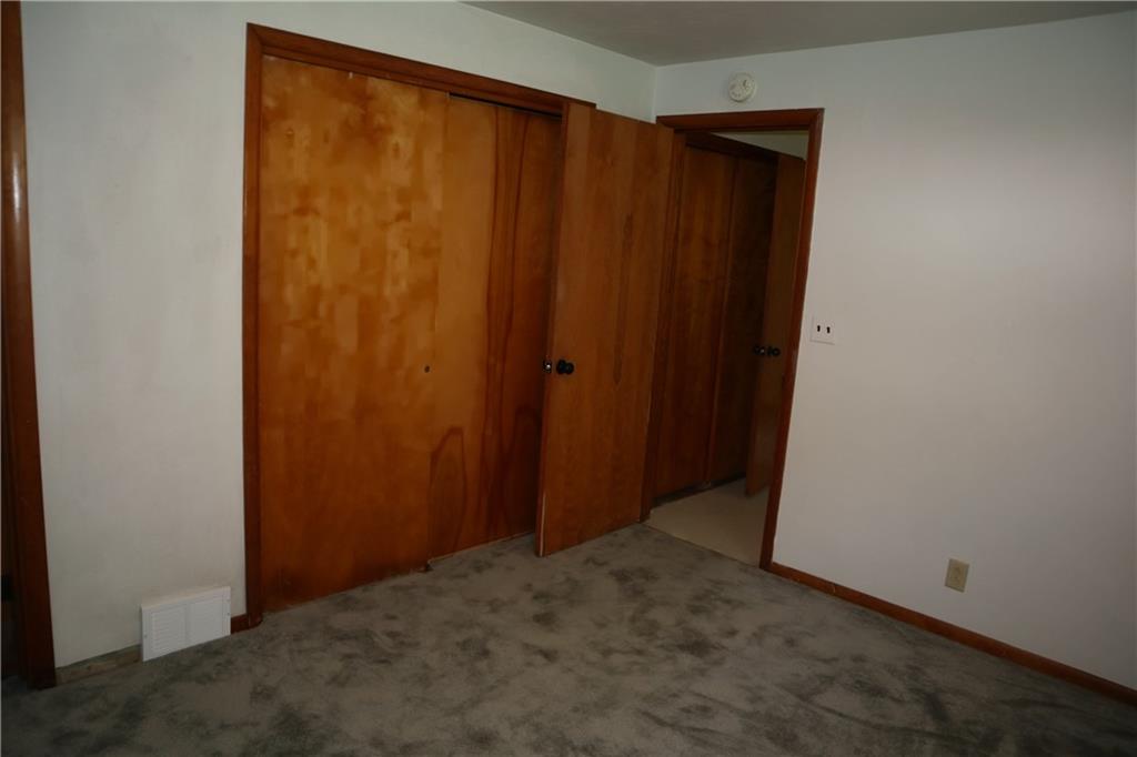 721 Spring Street Roscoe, PA 15477 - Photo 13 of 30 an empty room with wooden floor