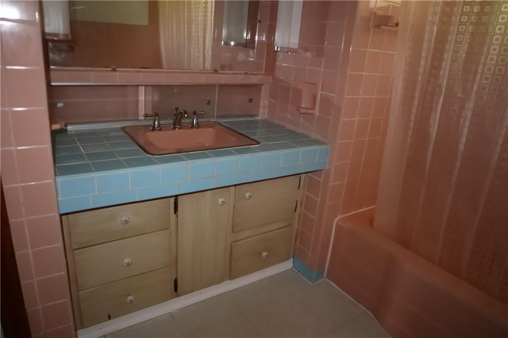 721 Spring Street Roscoe, PA 15477 - Photo 18 of 30 a bathroom with a sink and cabinets