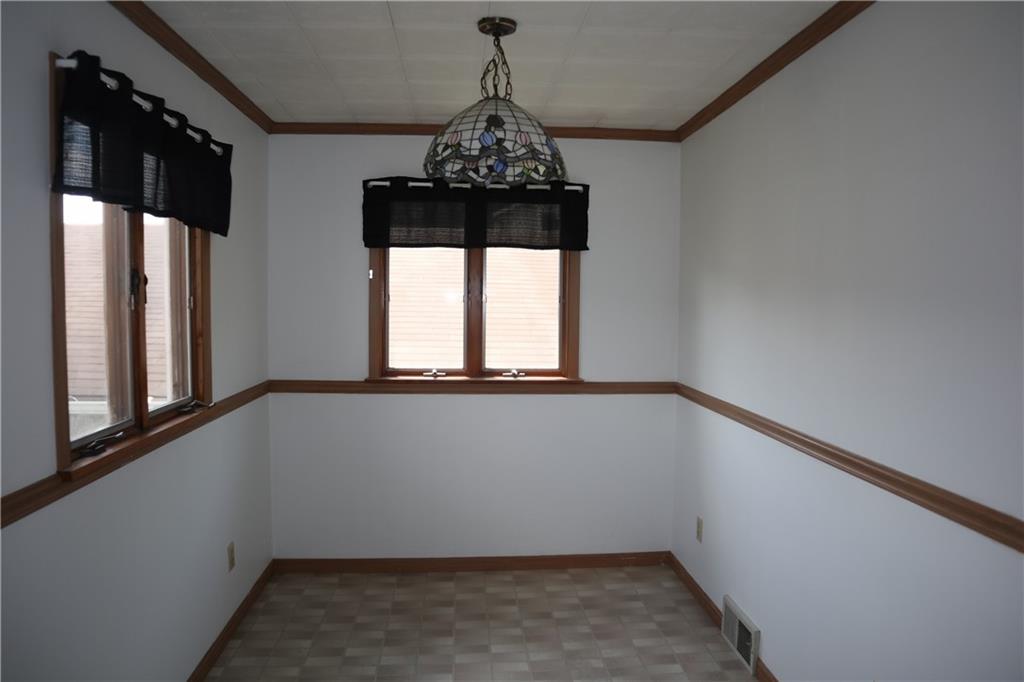721 Spring Street Roscoe, PA 15477 - Photo 6 of 30 wooden floor in an empty room with a window