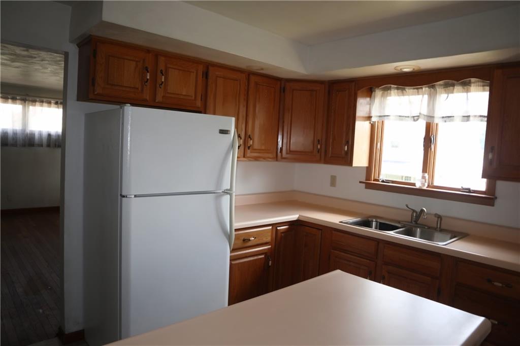 721 Spring Street Roscoe, PA 15477 - Photo 9 of 30 a white refrigerator freezer sitting inside of a kitchen