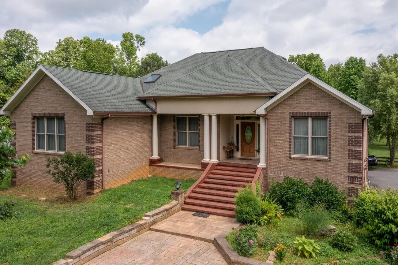 11511 Blair Road Apison, TN 37302 - Photo 1 of 76 a front view of a house with a yard