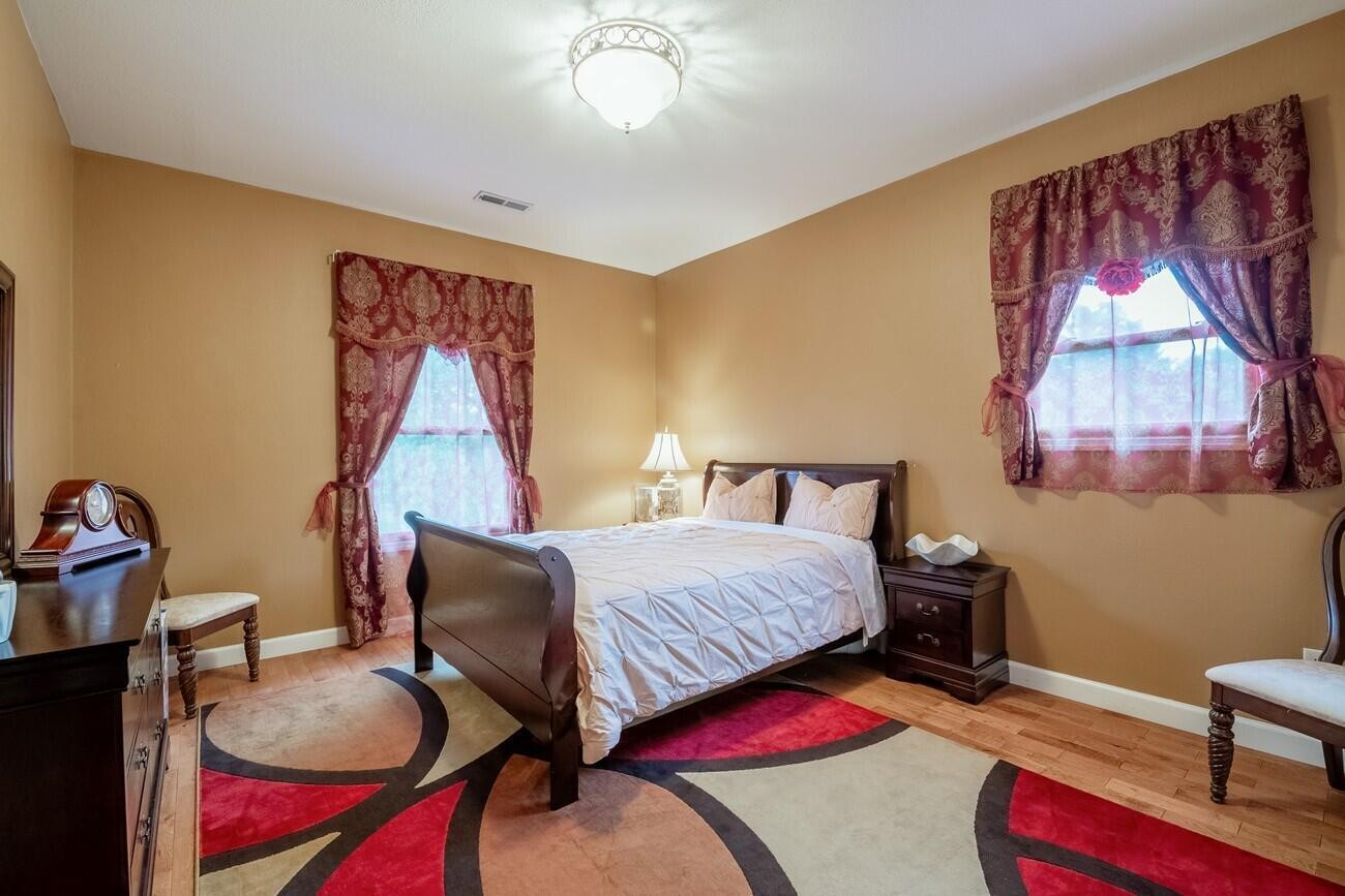 11511 Blair Road Apison, TN 37302 - Photo 41 of 76 a bedroom with furniture and a wooden floor