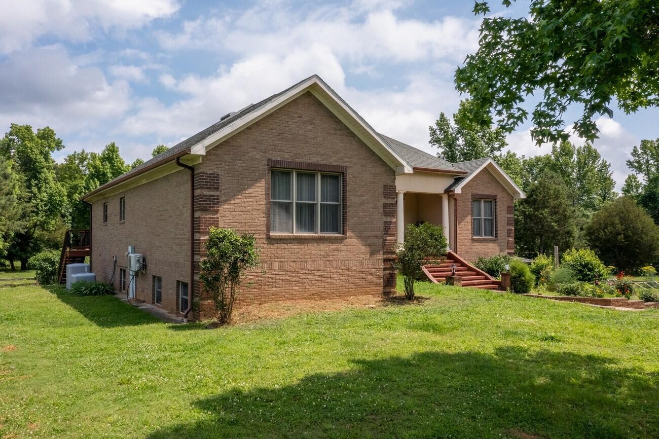 11511 Blair Road Apison, TN 37302 - Photo 5 of 76 a view of backyard of house with wooden deck and seating