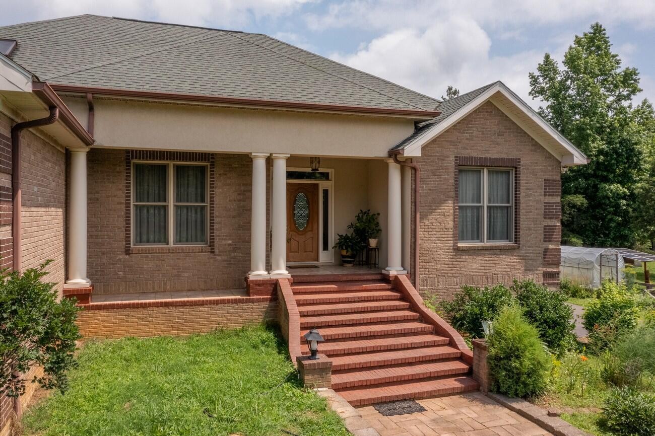 11511 Blair Road Apison, TN 37302 - Photo 6 of 76 a front view of a house with a yard