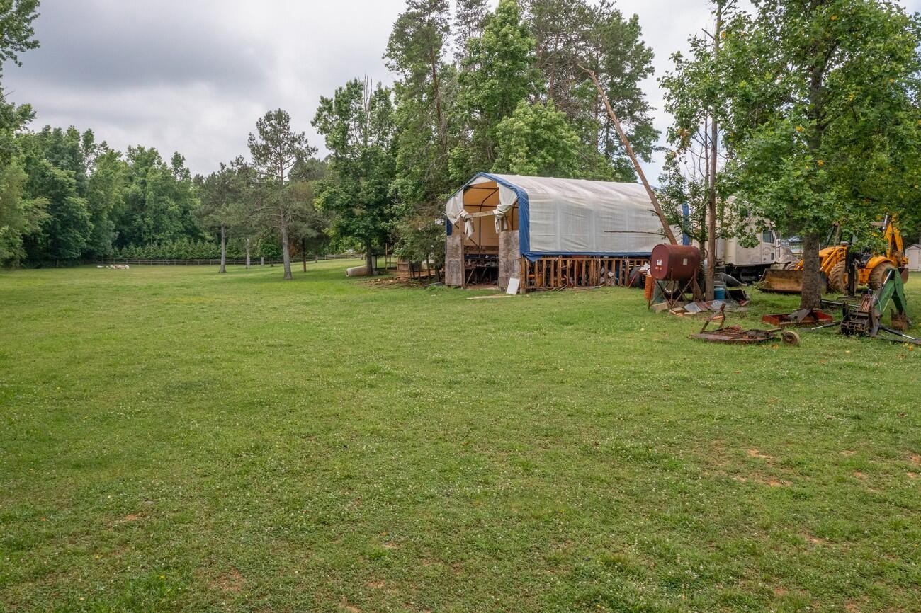 11511 Blair Road Apison, TN 37302 - Photo 61 of 76 a backyard of a house with table and chairs