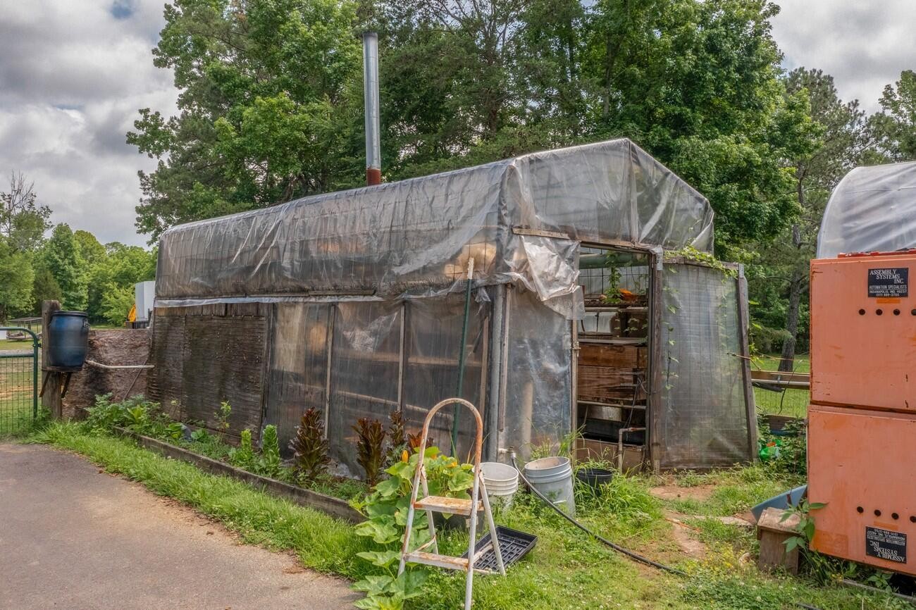 11511 Blair Road Apison, TN 37302 - Photo 69 of 76 a backyard of a house with barbeque oven and plants